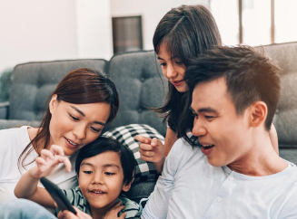 family looking at phone